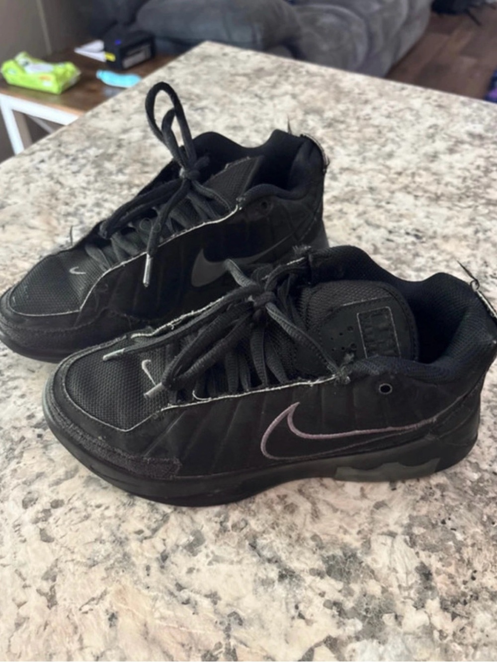 Nike Black Kids' Sneakers with Subtle Purple Swoosh